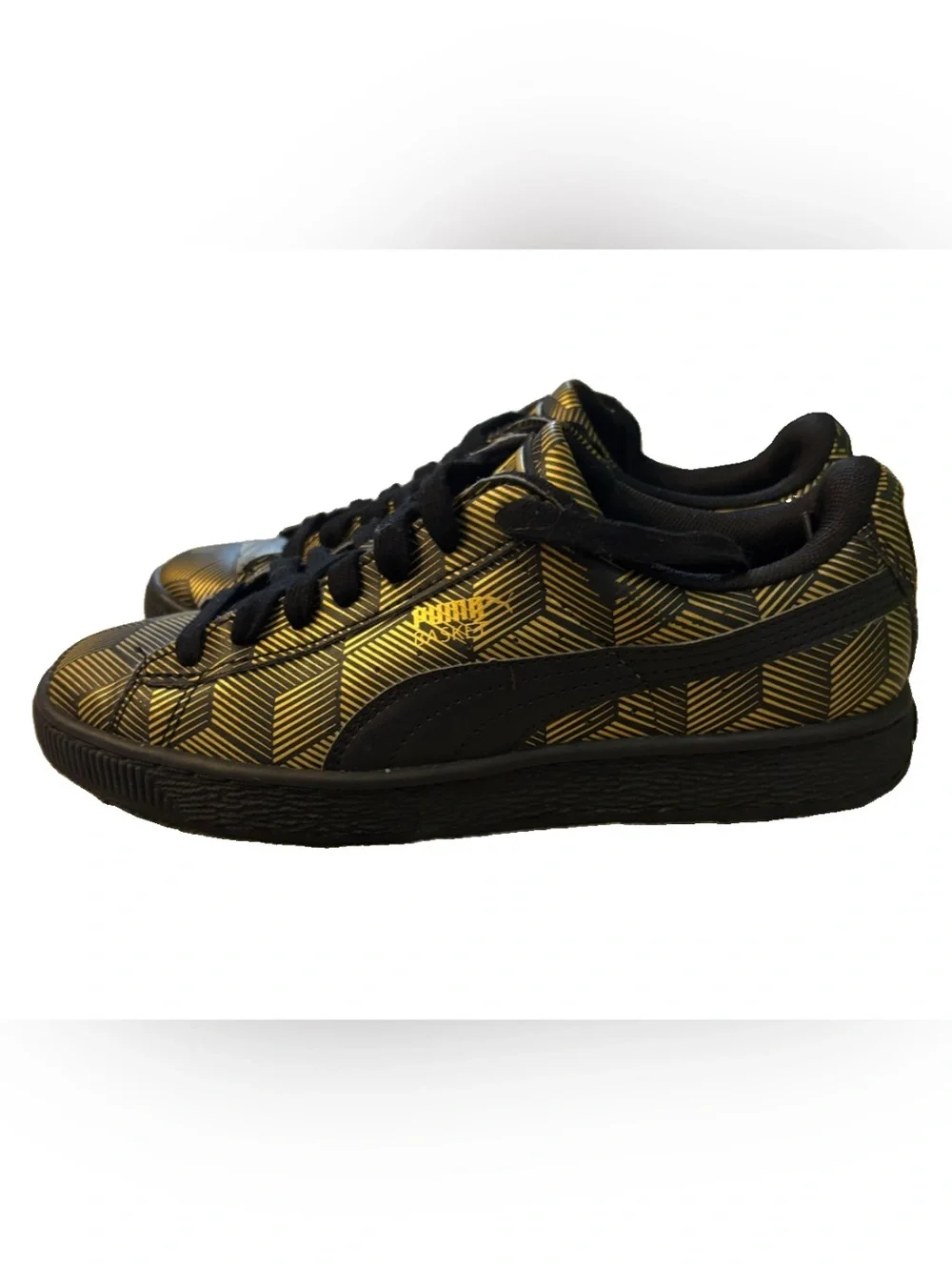 Puma low-top sneaker in black and metallic gold geometric print